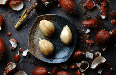 Directly above of snake fruits in bowl on table