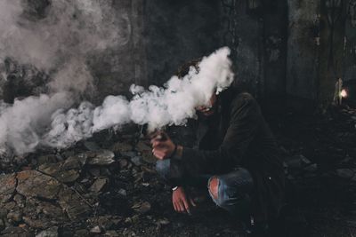 Man holding smoke bomb