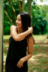 Young woman standing at park