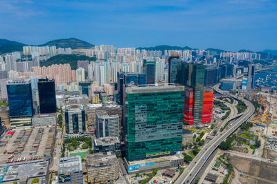 High angle view of buildings in city against sky