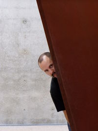 Portrait of man peeking