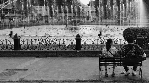 People sitting in front of building