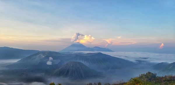 View of volcanic landscape against sky during sunset