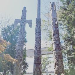 Low angle view of statue against trees