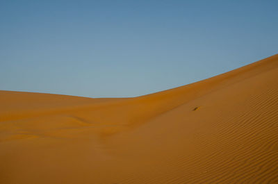 Scenic view of desert against clear sky