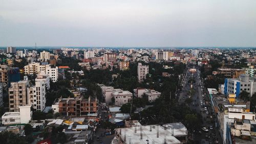 High angle view of buildings in city against clear sky