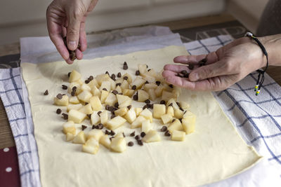 High angle view of man preparing food on table