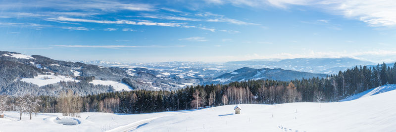 Scenic view of snowcapped mountains against sky