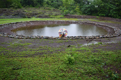 Rear view of man kayaking in lake