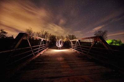 Bridge against sky at night