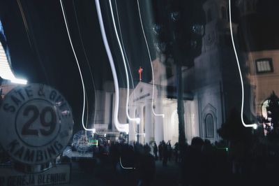 Group of people in front of building at night