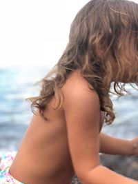 Rear view of woman at beach