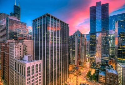 Modern buildings in city against sky