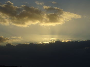 Low angle view of dramatic sky during sunset