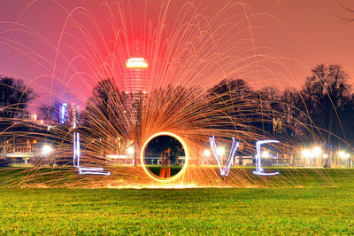 Light trails on grass at night