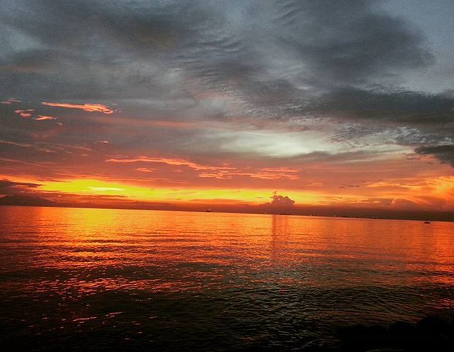 sunset, water, tranquil scene, sky, scenics, tranquility, beauty in nature, orange color, cloud - sky, sea, idyllic, reflection, waterfront, nature, cloud, cloudy, lake, dramatic sky, silhouette, rippled