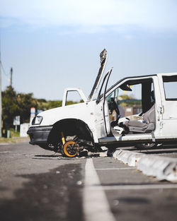 View of damaged car on street