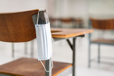 Close-up of empty chair on table