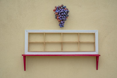 Directly above shot of fruits on table against wall