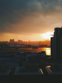 Cityscape against sky during sunset