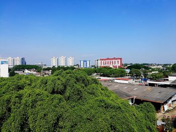 High angle view of trees and buildings against sky