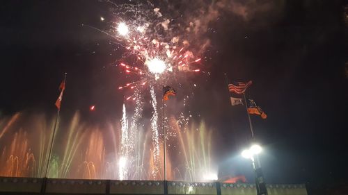 Low angle view of sky illumed with fire crackers