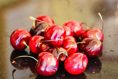Close-up of cherries on table