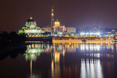 Reflection of illuminated buildings in water at night