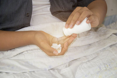 High angle view of woman lying on bed