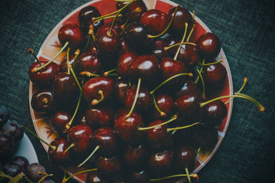 High angle view of cherries in bowl on table