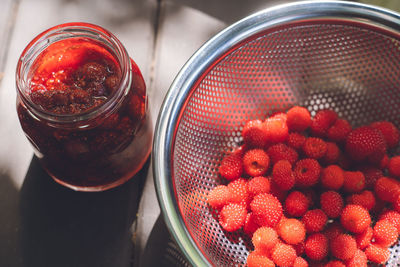 Making homemade jam from picked wild strawberries