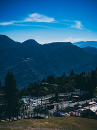 High angle view of buildings and mountains against sky