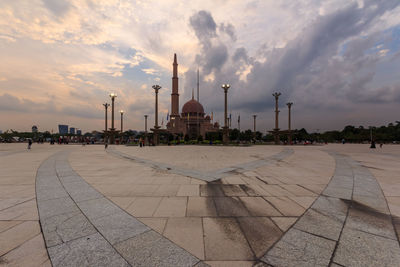 Panoramic view of building against sky during sunset