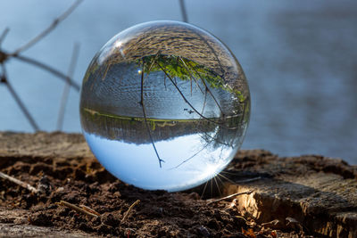 Close-up of crystal ball on glass