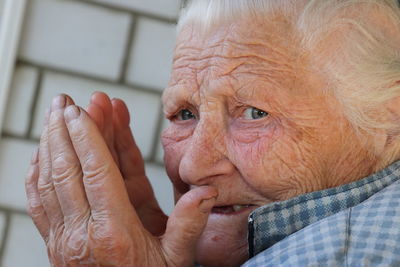 Close-up of man hand with tattoo at home