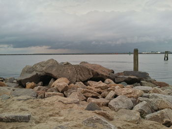 Scenic view of sea against cloudy sky