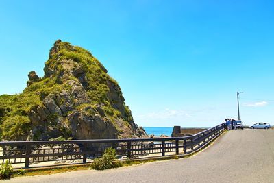 Scenic view of sea against clear blue sky