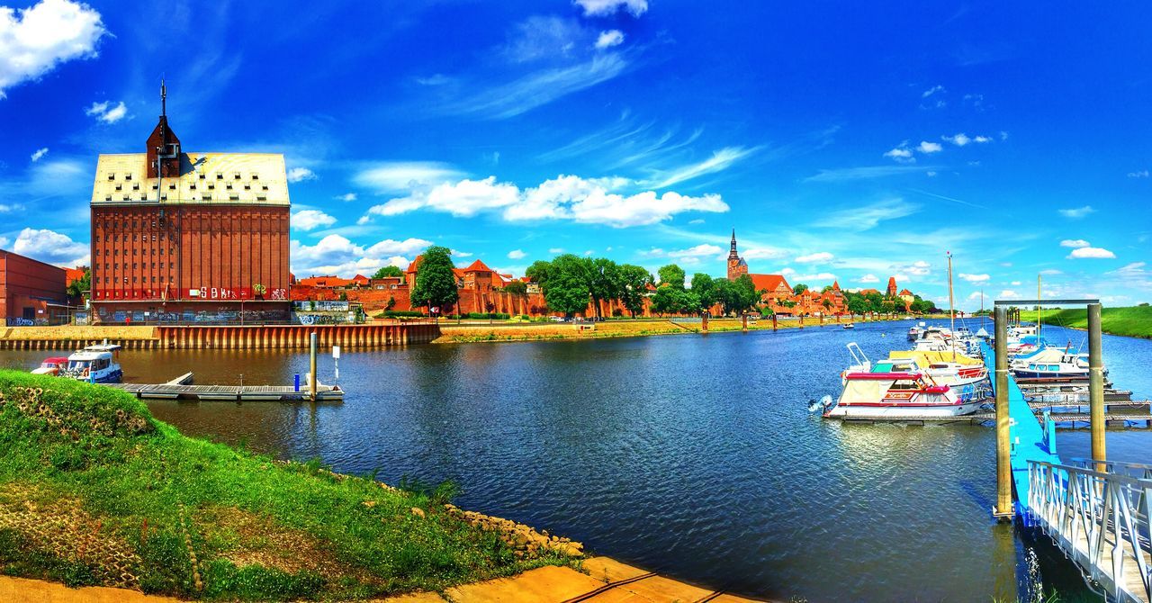 BOATS MOORED IN RIVER