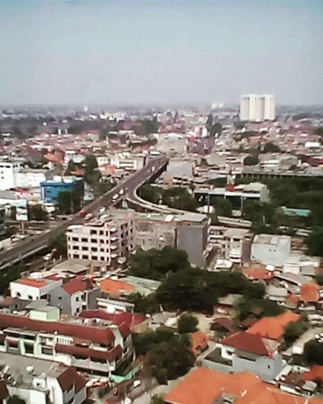 building exterior, architecture, built structure, cityscape, residential district, city, crowded, high angle view, residential structure, residential building, house, roof, clear sky, townscape, town, city life, day, sky, outdoors, community