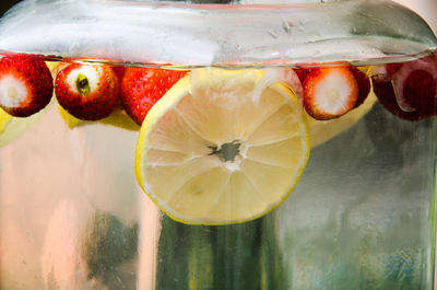 Close-up of fruits in glass container