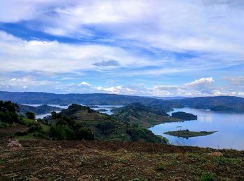 Scenic view of calm sea against cloudy sky