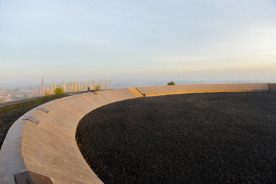 Road by land against sky