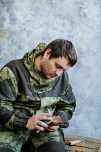 Army soldier holding handcraft