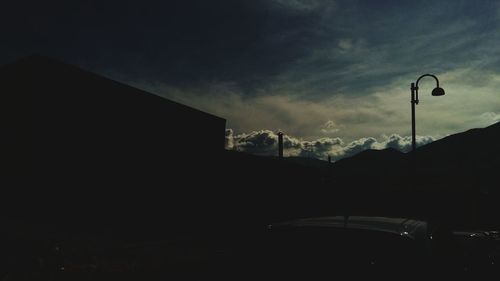 Low angle view of building against cloudy sky