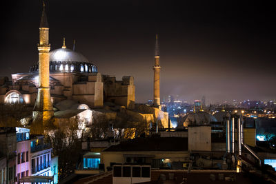 Illuminated buildings in city at night