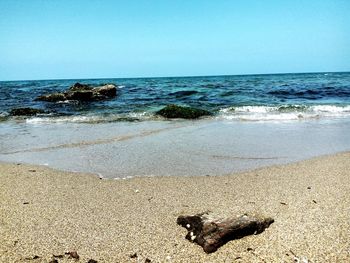 Scenic view of sea against clear sky