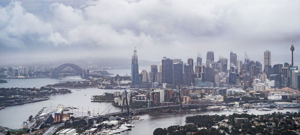 Sydney harbour bridge over paramatta river with cbd in background