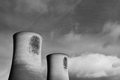 Low angle view of smoke stack against sky