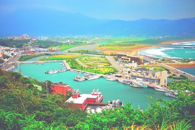 Scenic view of sea with cityscape in background