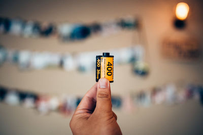 Close-up of cropped hand holding cigarette
